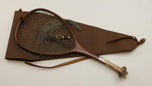 Landing net with walnut and elk antler shown with leather case.