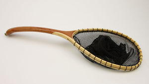 Landing net with curved handle and bamboo hoop.
