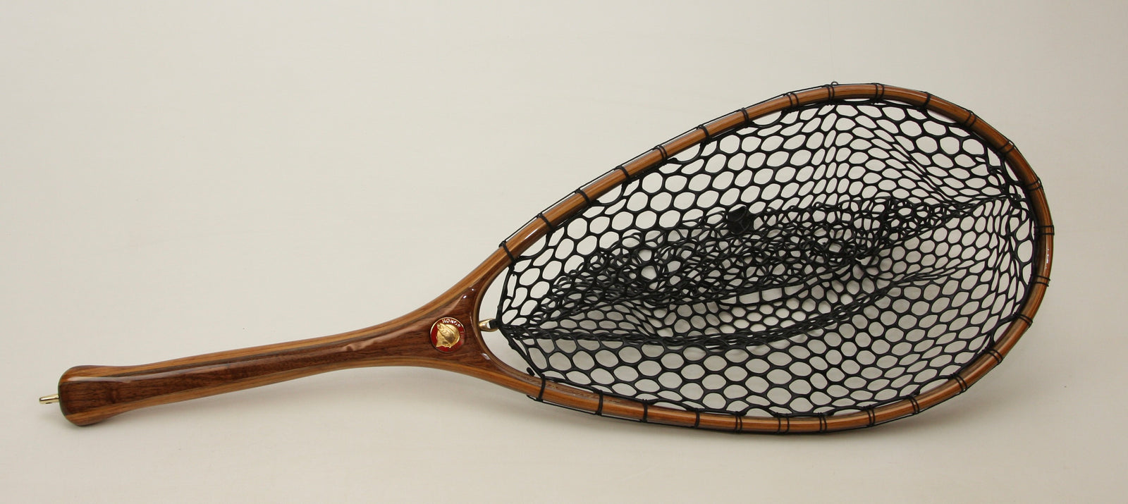 Larger hoop, less bounce, A net in Cherry and Walnut.