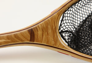 Close up of landing net with walnut inset.