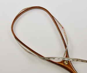 Measuring the hoop of a landing net with a flexible measuring tape.