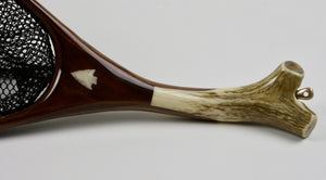 Close-up of elk antler handle and arrowhead inset.