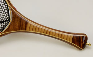 Close up of a stacked bamboo handle with Koa accents.