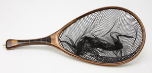 Landing net with segmented black palm handle and zebra wood hoop.