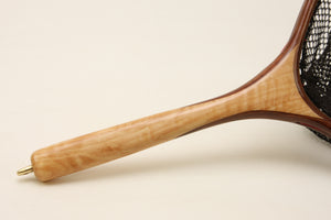 Close up of landing net handle made with light colored wood.
