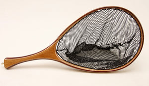 Fly fishing landing net with contrasting light and dark wood. 