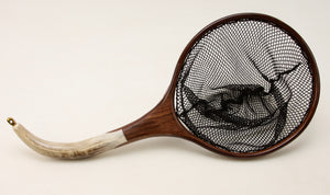 Landing net with curved antler handle and circualr hoop.
