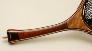 Landing net handle of maple and koa with a gently curved shape.