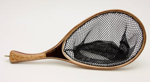 Small trout net with handle that is one half light wood and one half dark wood.