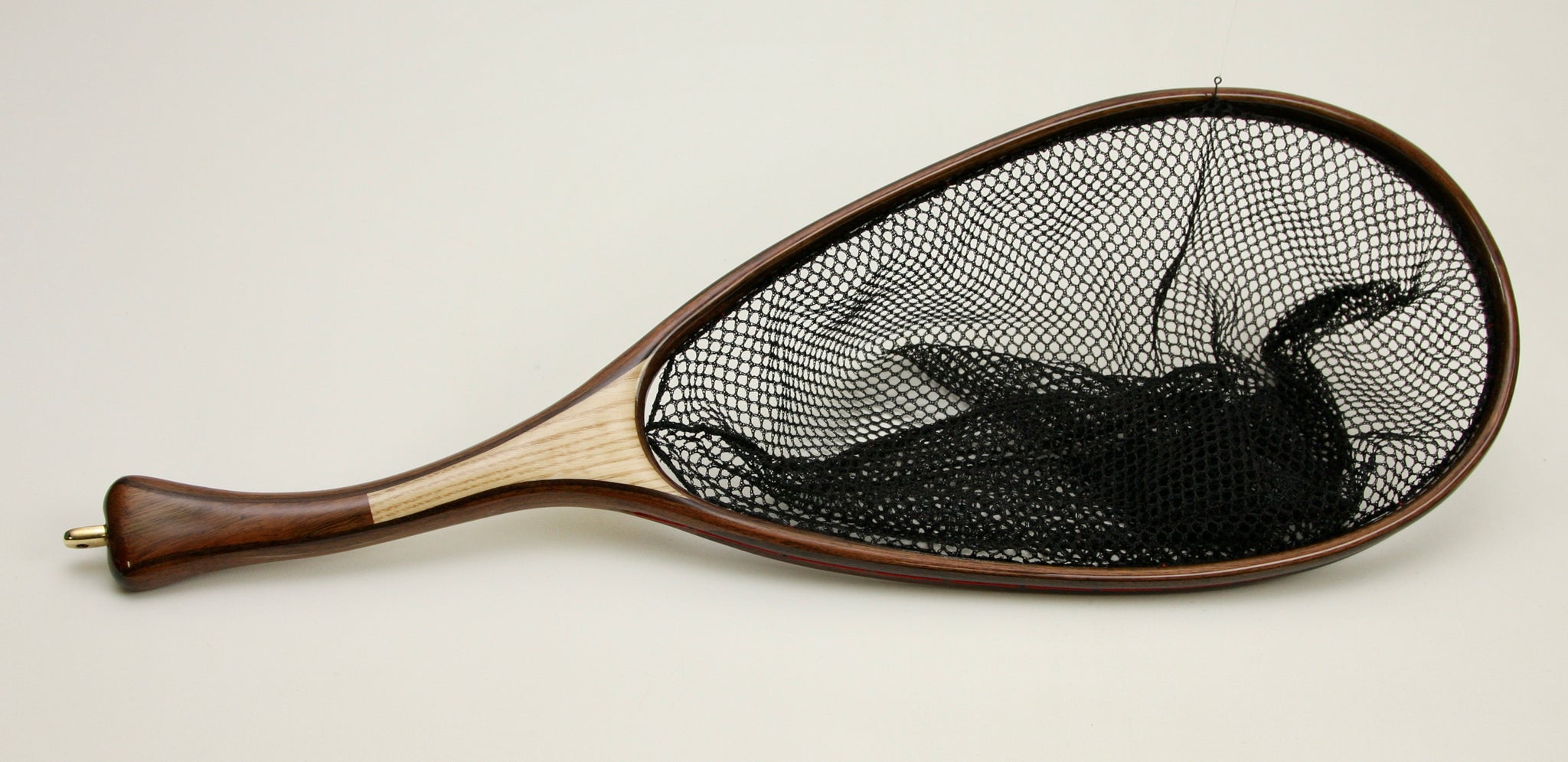 Custom wooden fly fishing net with curved handle and elongated
