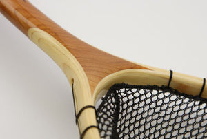 Close up of landing net showing the cherry and bamboo.